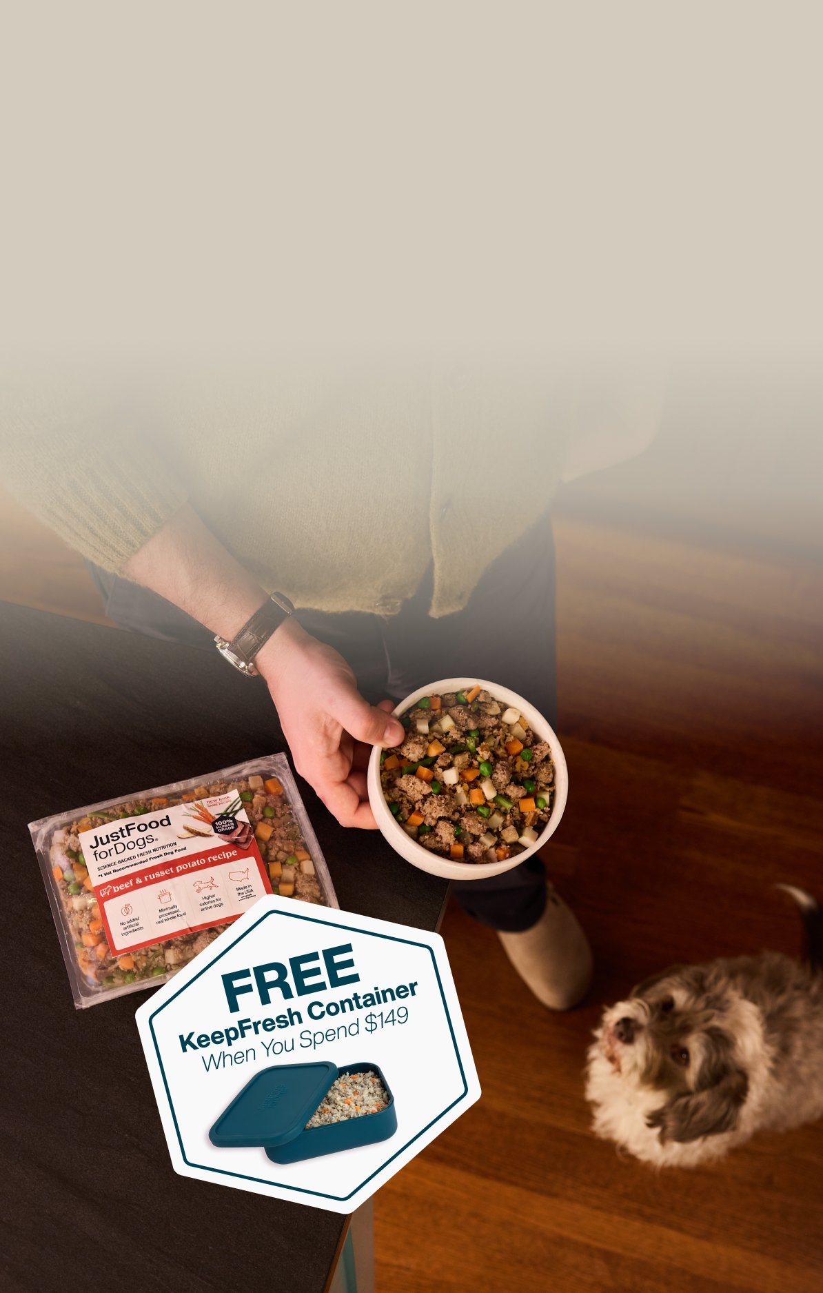 picture of a man holding a dog and bowl of food