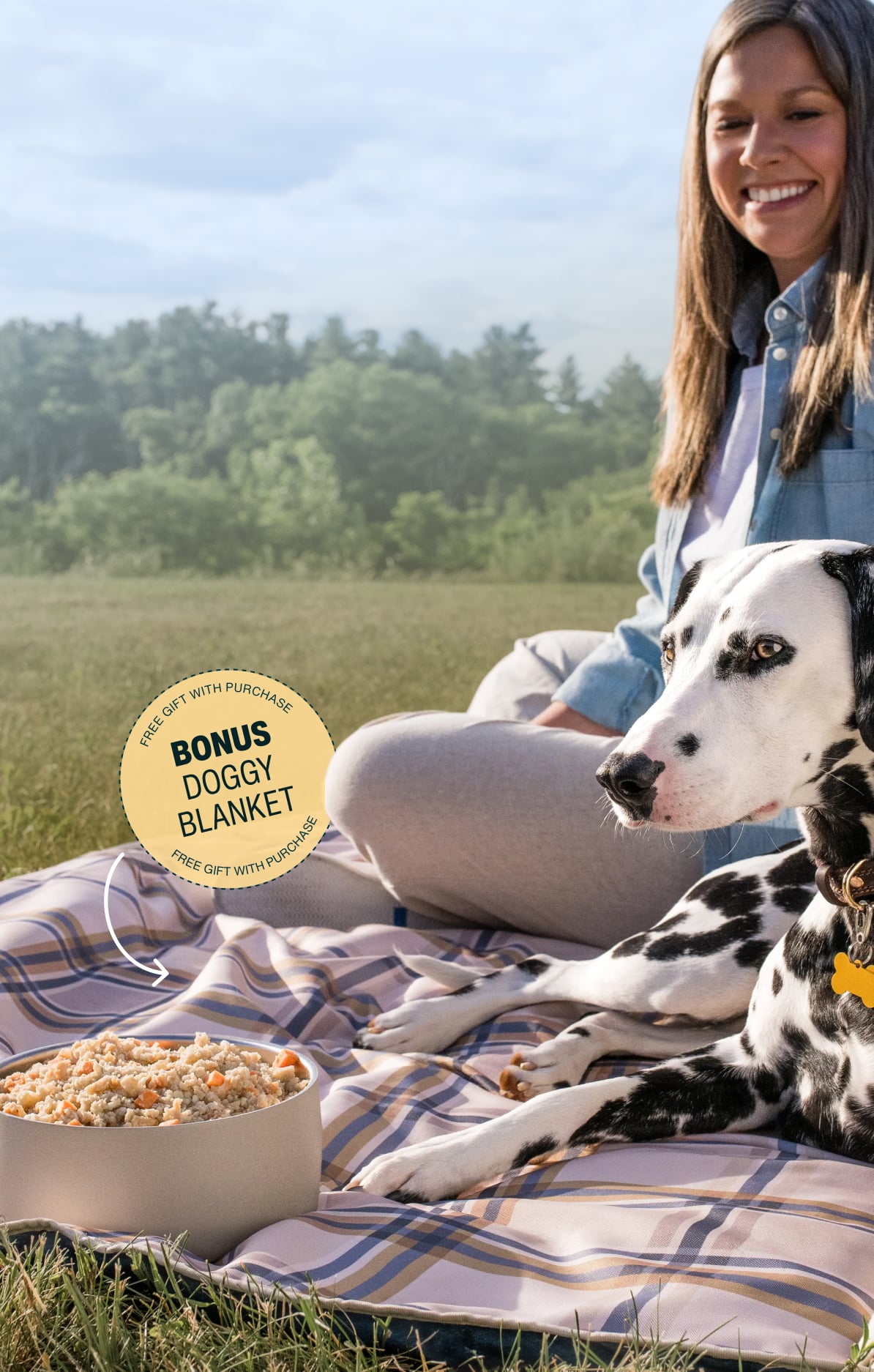 picture of a man holding a dog and bowl of food