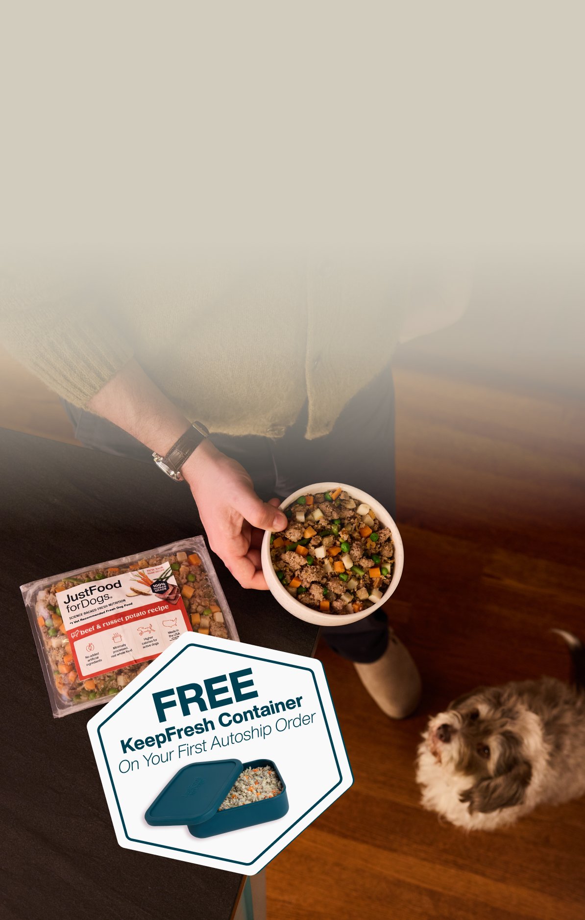 picture of a man holding a dog and bowl of food