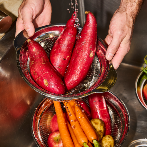 prepping sweet potatoes and carrots