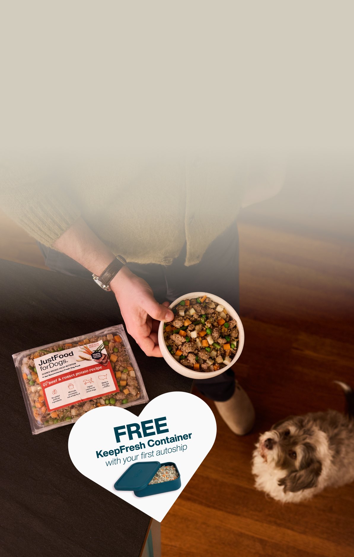 picture of a man holding a dog and bowl of food